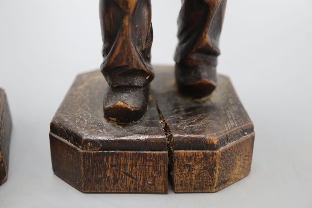Two carved wood figures of workmen, with ivory faces, signed Neri, height 31cm